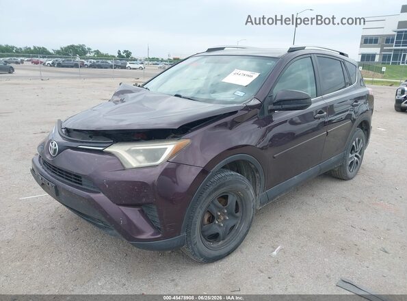 2T3ZFREV3GW267914 2016 TOYOTA RAV4 Burgundy Vista tres cuartos delantera izquierda