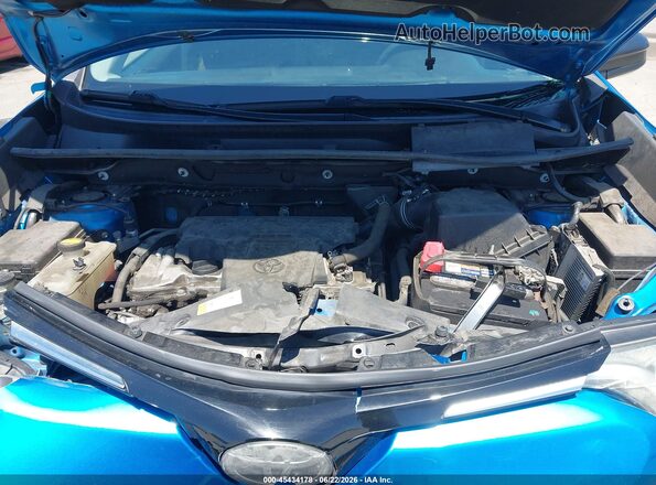 2T3ZFREV3JW440306 2018 TOYOTA RAV4 Blue Rear view