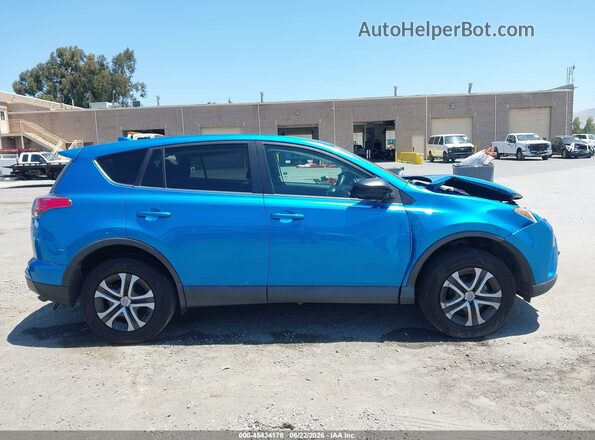 2T3ZFREV3JW440306 2018 TOYOTA RAV4 Blue Rear interior view