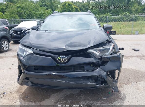 2T3ZFREV9JW455652 2018 TOYOTA RAV4 Black Front view