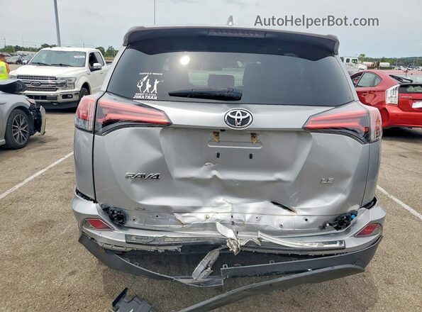 2T3ZFREV9JW499991 2018 TOYOTA RAV4 Серебряный Вид сзади