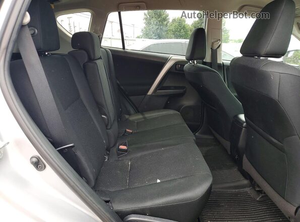 2T3ZFREV9JW499991 2018 TOYOTA RAV4 Серебряный Вид задней части салона