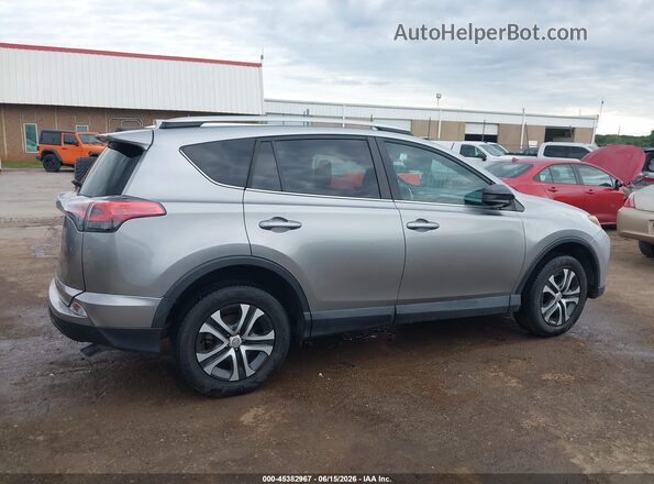 2T3ZFREVXGW309348 2016 TOYOTA RAV4 Silver Vista interior trasera