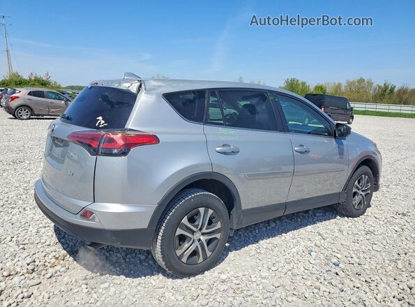 2T3ZFREVXJW519570 2018 TOYOTA RAV4 Silver Rear right