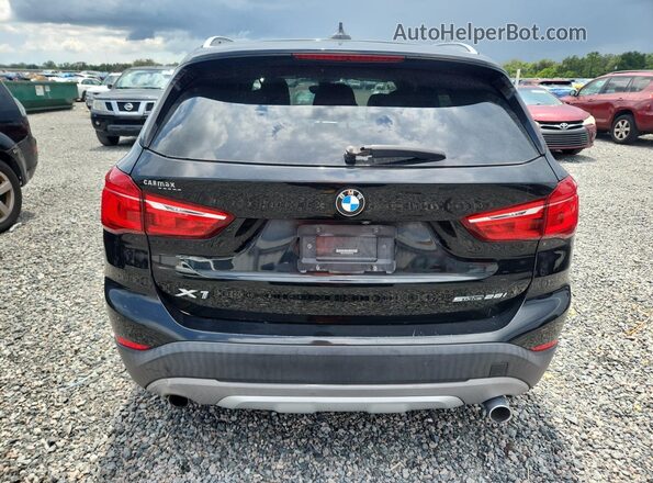 WBXHU7C30J3H43138 2018 BMW X1 Black Vista interior delantera