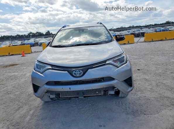 JTMRJREV5JD213856 2018 TOYOTA RAV4 Серебряный Вид сзади