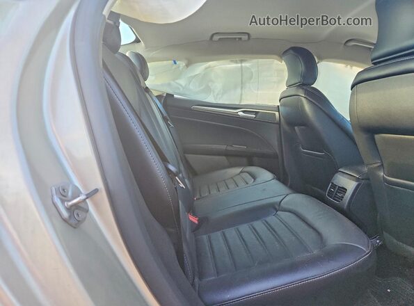 3FA6P0HD2HR404979 2017 FORD FUSION Gold Rear seats view