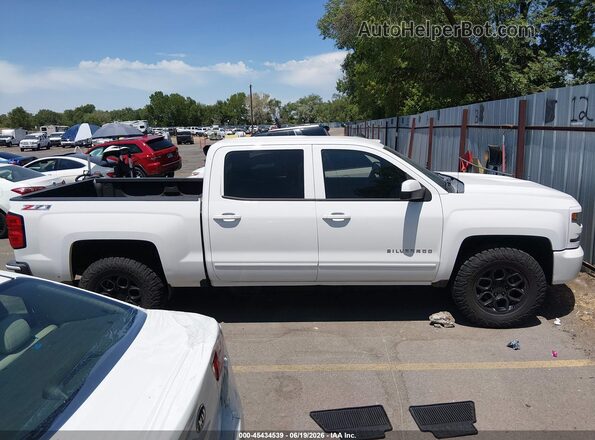 3GCUKREC6HG319588 2017 CHEVROLET SILVERADO White Widok wnętrza z tyłu