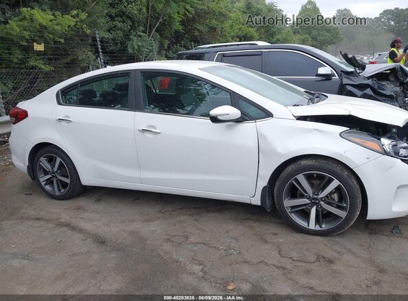 3KPFL4A84HE007100 2017 KIA FORTE White Rear interior view