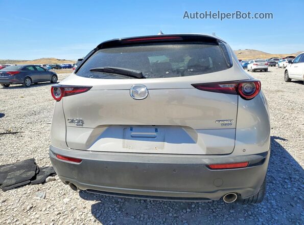 3MVDMBEY3RM677696 2024 MAZDA CX-30 Gold Rear view