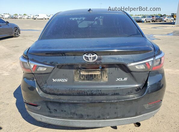 3MYDLBYV0KY519094 2019 TOYOTA YARIS Black Rear view