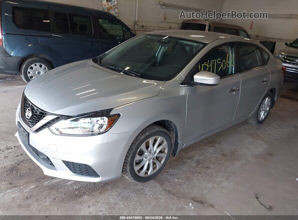 3N1AB7AP0JY231901 2018 NISSAN SENTRA Silver Vista tres cuartos delantera izquierda