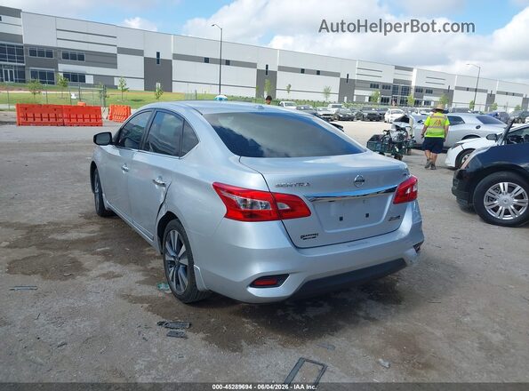 3N1AB7AP2KY429283 2019 NISSAN SENTRA Серебряный Задняя левая четверть
