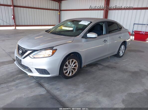 3N1AB7APXJY207704 2018 NISSAN SENTRA Silver Vista tres cuartos delantera izquierda