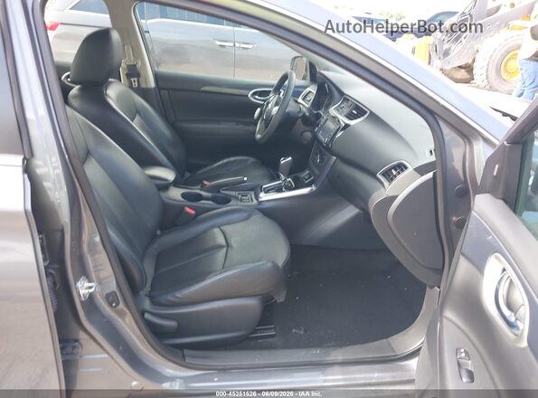 3N1CB7AP5JY203973 2018 NISSAN SENTRA Серый Вид салона спереди