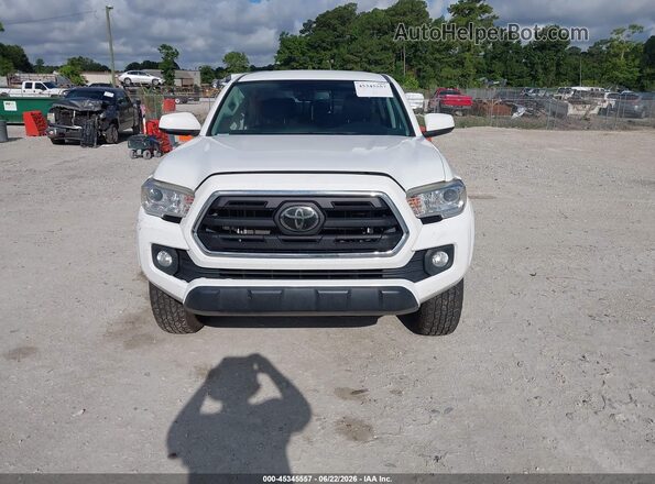3TMAZ5CN6KM078975 2019 TOYOTA TACOMA White Սարքավորումների վահանակի տեսք
