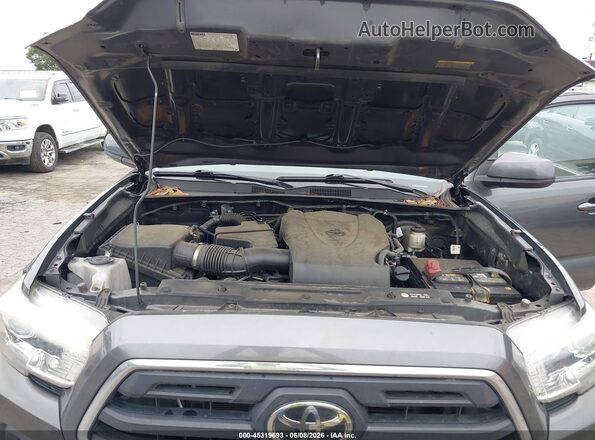 3TMAZ5CN9JM074255 2018 TOYOTA TACOMA Gray Vista trasera