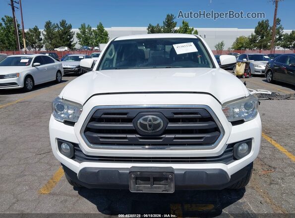 3TMBZ5DN8KM019543 2019 TOYOTA TACOMA White Вид задньої частини салону