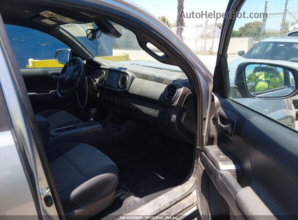 3TMBZ5DN8LM025926 2020 TOYOTA TACOMA Серебряный Вид салона спереди
