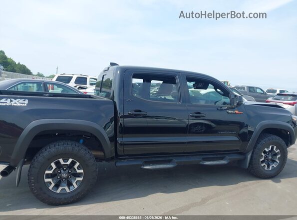 3TMCZ5AN2PM565772 2023 TOYOTA TACOMA Black Vista interior trasera