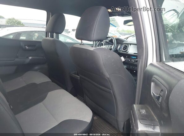 3TMCZ5AN3PM604854 2023 TOYOTA TACOMA White Widok naklejki z numerem VIN