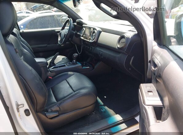 3TMCZ5AN4KM247144 2019 TOYOTA TACOMA White წინა სალონის ხედი