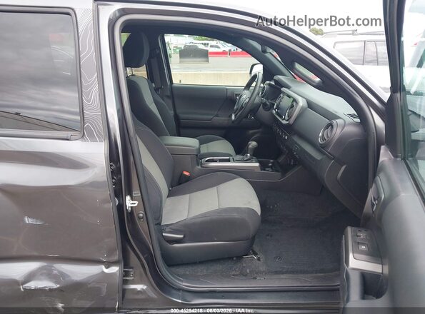 3TMCZ5AN7PM588979 2023 TOYOTA TACOMA Gray Front interior view