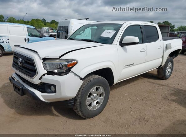 3TMCZ5AN9GM013900 2016 TOYOTA TACOMA White Vista tres cuartos delantera izquierda