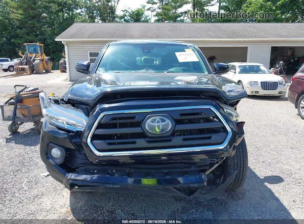 3TMCZ5AN9KM281645 2019 TOYOTA TACOMA Black Widok wnętrza z tyłu