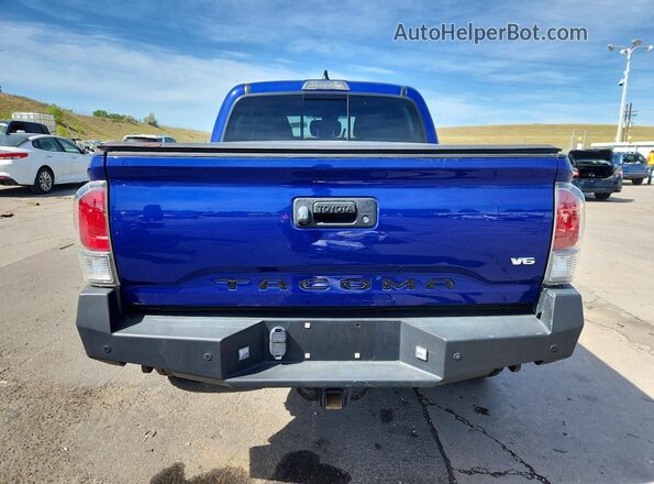 3TMCZ5AN9PM579703 2023 TOYOTA TACOMA Blue Vista trasera