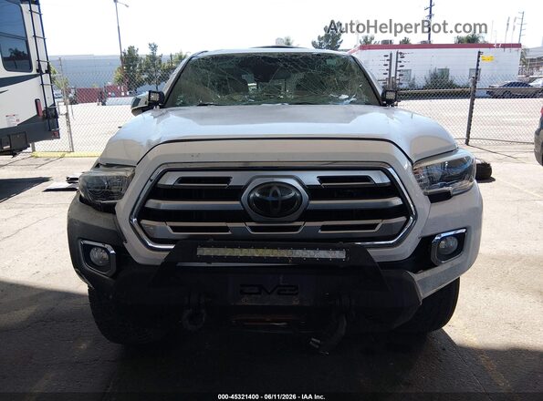 3TMGZ5AN2JM167857 2018 TOYOTA TACOMA Белый Вид задней части салона