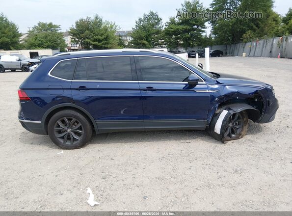3VVMB7AX4RM168302 2024 VOLKSWAGEN TIGUAN Blue Vista interior trasera