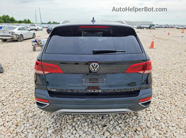 3VVSX7B28PM313382 2023 VOLKSWAGEN TAOS Black Rear view