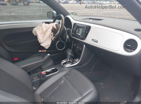 3VW5DAAT9KM502253 2019 VOLKSWAGEN BEETLE Silver Widok wnętrza z przodu