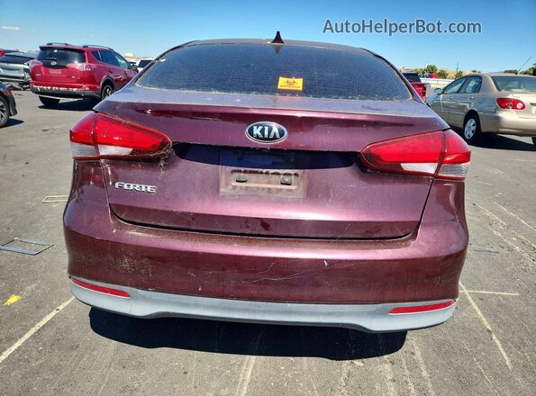 3KPFL4A75HE147003 2017 KIA FORTE Maroon Front interior view