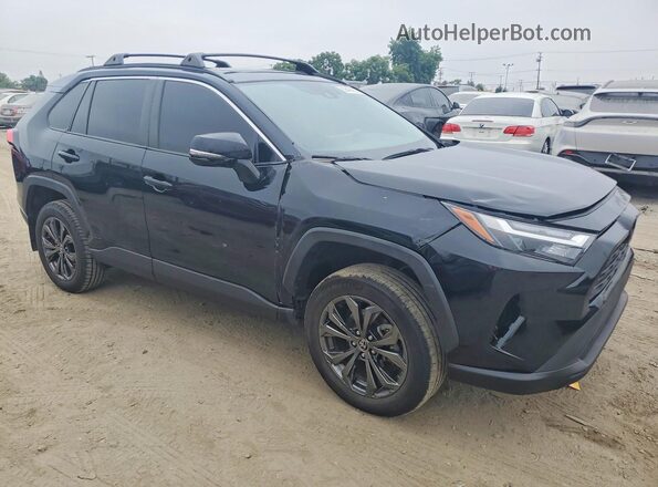JTMB6RFV3PD083067 2023 TOYOTA RAV4 Black Front view