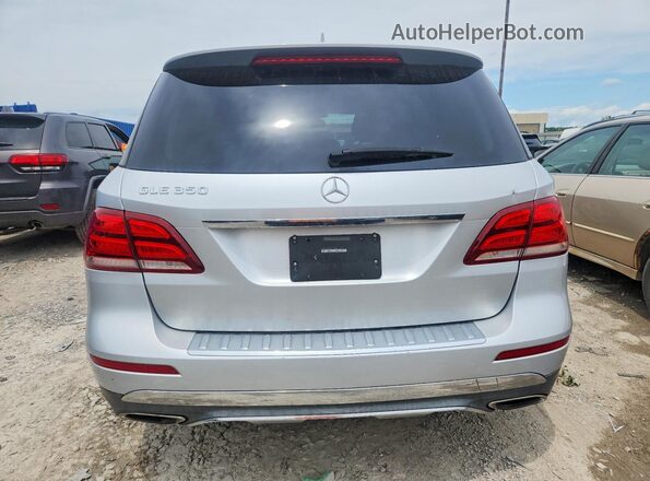 4JGDA5JB0GA711032 2016 MERCEDES-BENZ GLE Silver Հետևի տեսք