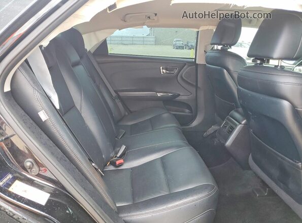 4T1BD1EB3JU063578 2018 TOYOTA AVALON Black Rear seats view