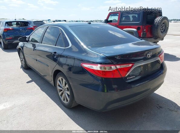 4T1BF1FK4GU586416 2016 TOYOTA CAMRY Gray Trasero izquierdo
