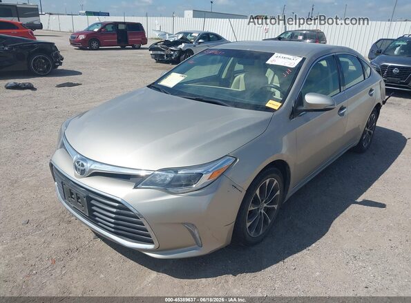 4T1BK1EB1GU210981 2016 TOYOTA AVALON Gold Vista tres cuartos delantera izquierda