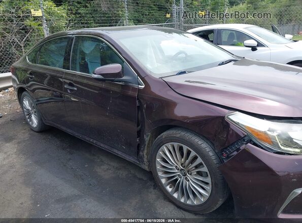 4T1BK1EB7GU212119 2016 TOYOTA AVALON Purple Rear interior view