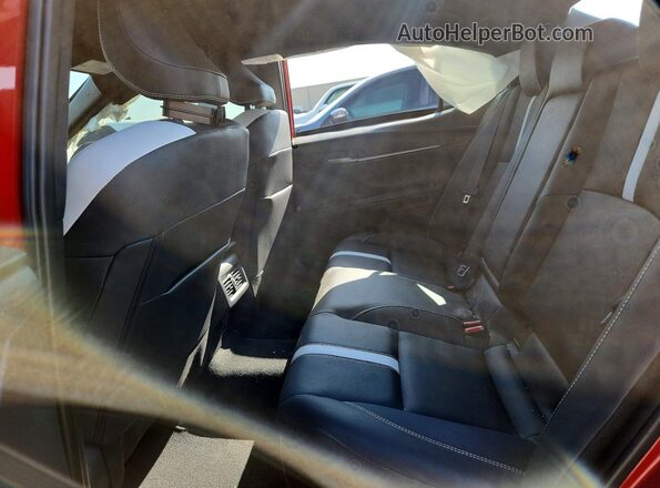4T1DAACK2SU180428 2025 TOYOTA CAMRY Red Rear seats view