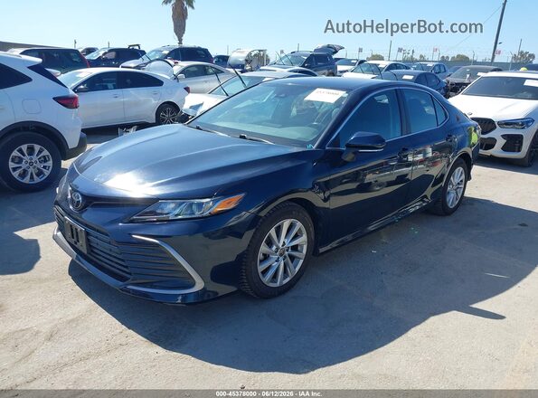4T1R11BK3MU032962 2021 TOYOTA CAMRY Dark Blue Vista tres cuartos delantera izquierda