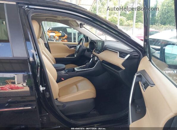 4T3B6RFV9MU019355 2021 TOYOTA RAV4 HYBRID Black Front interior view
