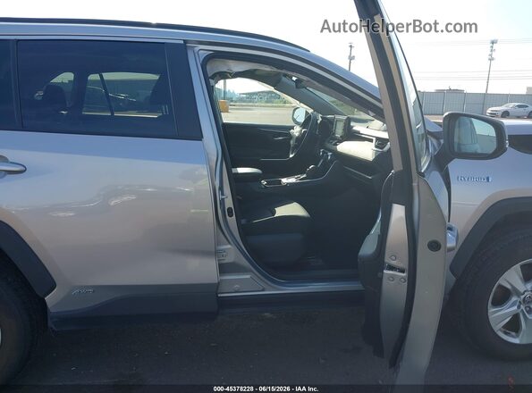 4T3RWRFV9MU038454 2021 TOYOTA RAV4 HYBRID Silver Front interior view