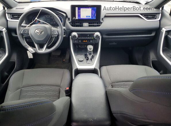 4T3T6RFV5PU128744 2023 TOYOTA RAV4 White Dashboard view