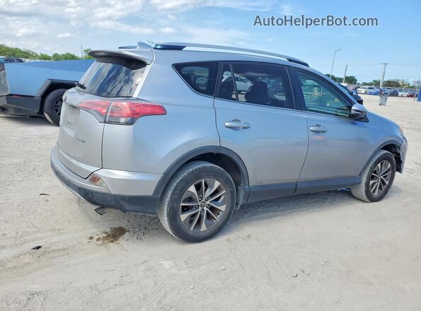 JTMRJREV5JD213856 2018 TOYOTA RAV4 Серебряный Передняя правая четверть
