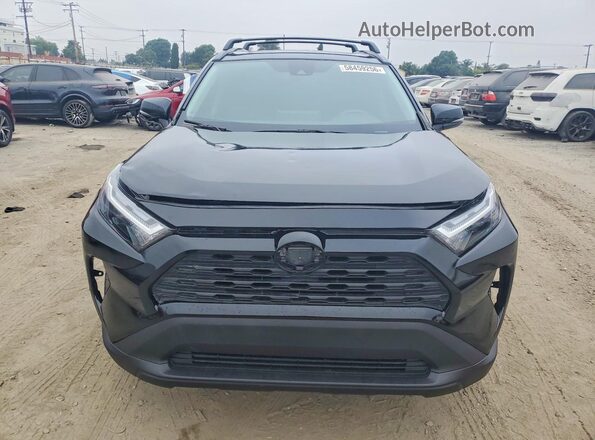 JTMB6RFV3PD083067 2023 TOYOTA RAV4 Black Rear view