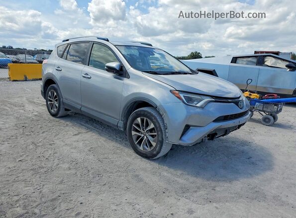 JTMRJREV5JD213856 2018 TOYOTA RAV4 Серебряный Вид спереди