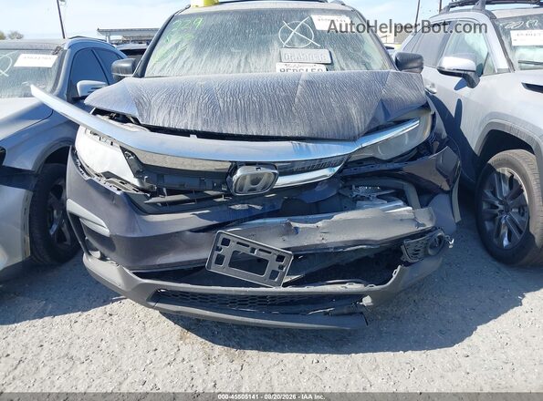 5FNYF5H16KB001475 2019 HONDA PILOT Blue Rear interior view